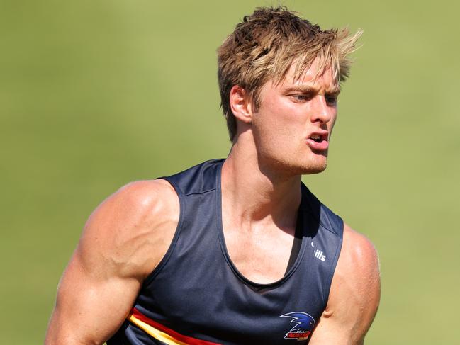 ADELAIDE, AUSTRALIA - JANUARY 07: Jackson Hately of the Crows handballs during an Adelaide Crows AFL training session at Westlakes on January 07, 2021 in Adelaide, Australia. (Photo by Daniel Kalisz/Getty Images)