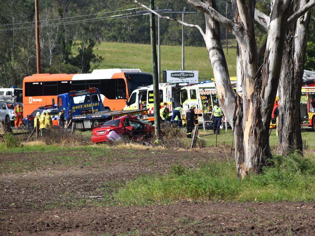 Multiple emergency services crews attended and after-school traffic was blocked after a red sedan Mitsubishi Lancer sedan crashed into a power pole on Rogans Bridge Rd north of Waterview Heights on Thursday, 18th February, 2021. Photo Bill North / The Daily Examiner