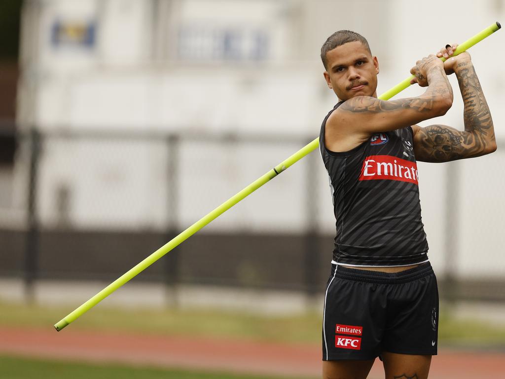 Bobby Hill practises his golf swing before training. Picture: Michael Klein