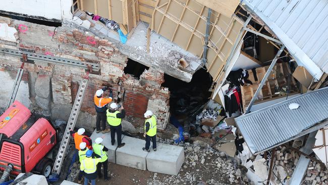 Workers inspecting the Myer redevelopment site following flooding that caused buildings from Cat and Fiddle Arcade to collapse. Picture: NIKKI DAVIS-JONES