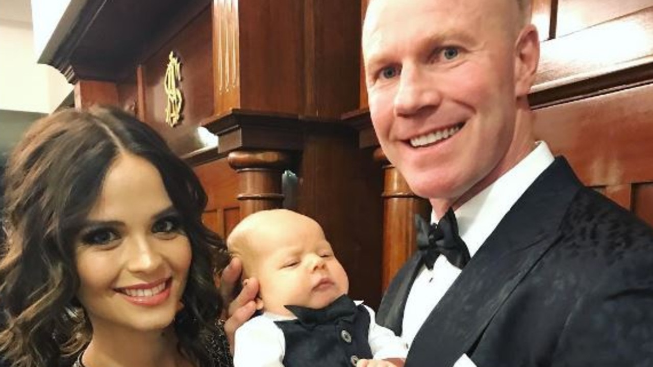 Lauren Brant and Barry Hall with their first baby, Miller, at the AFL hall of fame event. Picture: Instagram / Lauren Brant.