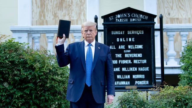 President Donald Trump holds a Bible while visiting St. John's Church across from the White House after the protests. Picture: Brendan Smialowski/AFP