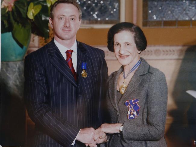 Peter Price with former NSW Governor Marie Bashir receiving the Order of Australia Medal in 2009.