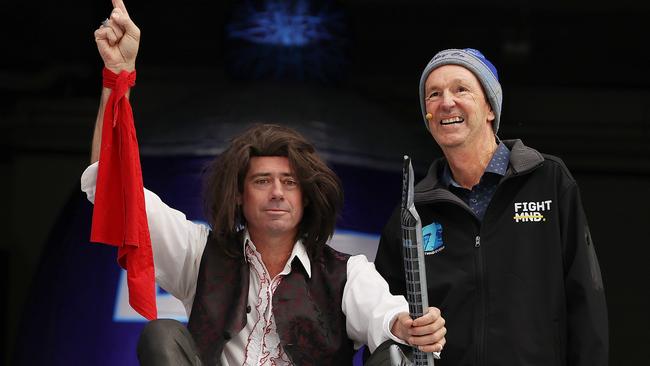 Gillon McLachlan dressed as Meat Loaf with Neale Daniher as he prepares to take the slide in this year’s Big Freeze 7. Picture: Michael Klein