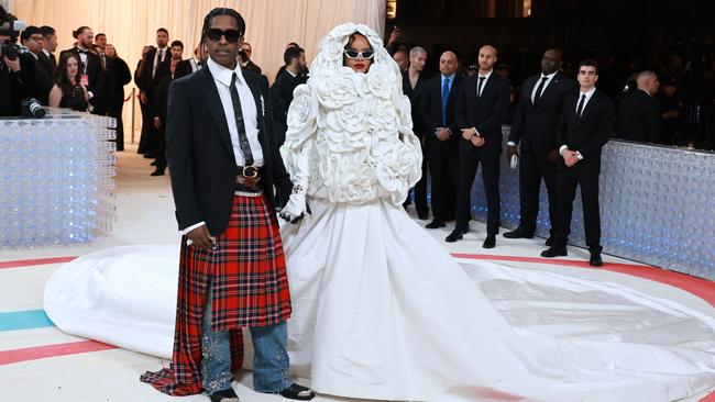 A$AP Rocky, in Gucci, references Karl Largerfeld’s love of kilts as he and Rihanna hit the white carpet. Picture: Getty Images for Karl Lagerfeld