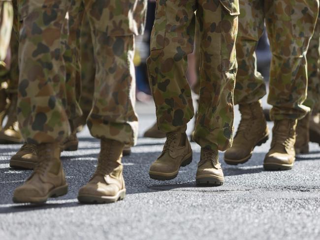 Feet of soldiers marching at an ANZAC Day parade on the streets of a regional country town