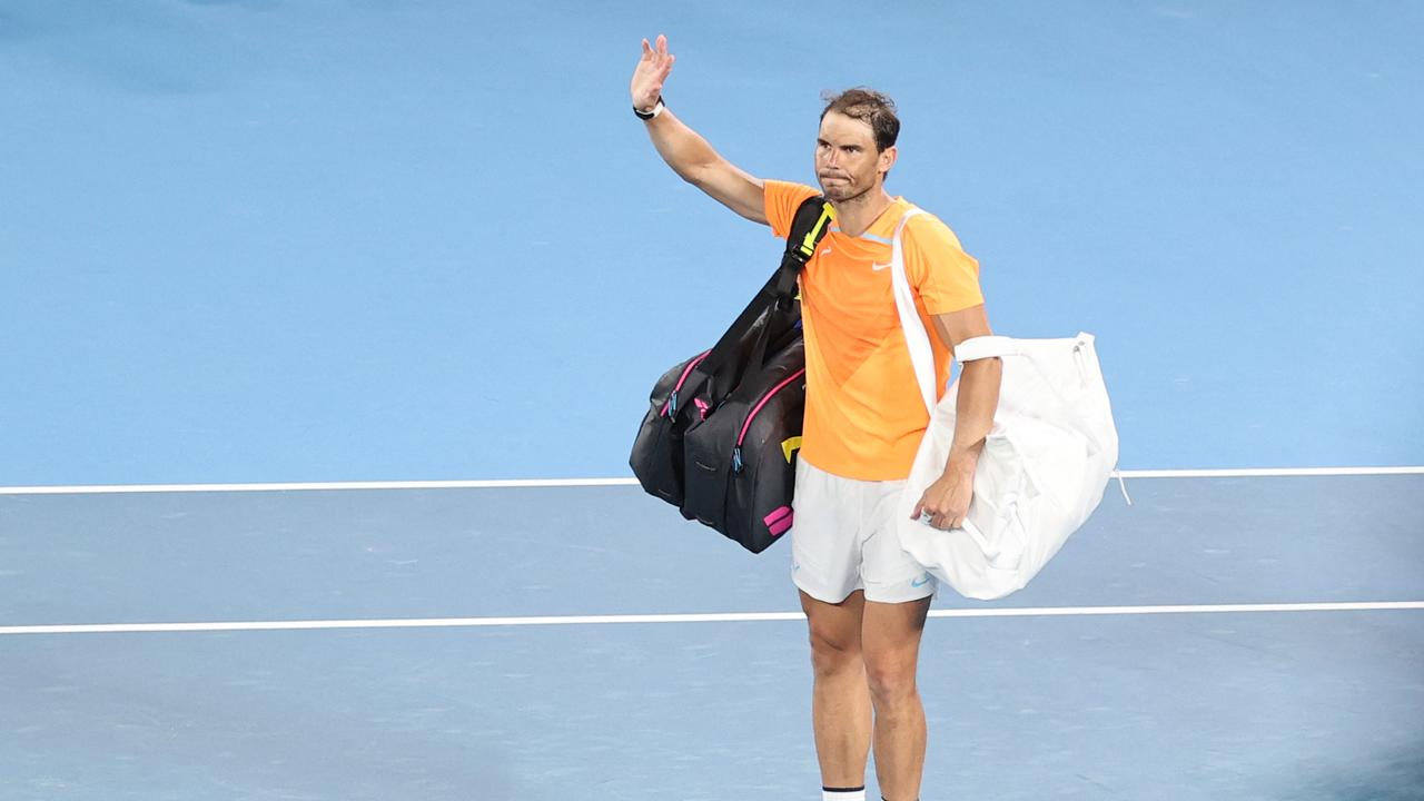 TOPSHOT - Spain's Rafael Nadal waves as he leave. (Photo by Martin KEEP / AFP)