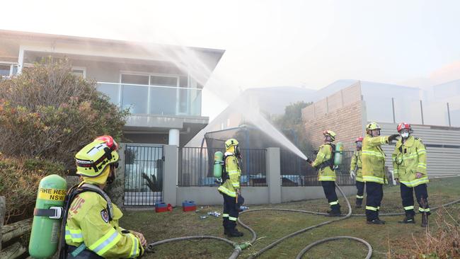 Firefighters carrying out a hazard reduction burn in North Curl Curl. Picture: David Swift.