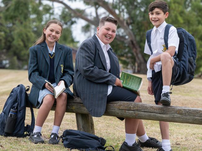 St John's Regional College students, Holly Egan, Flynn Hyland and Daniel Hainagiu are starting year 7 this year. Dressed in their uniform with their school bags. All are excited to be going to school soon. Picture: Tony Gough