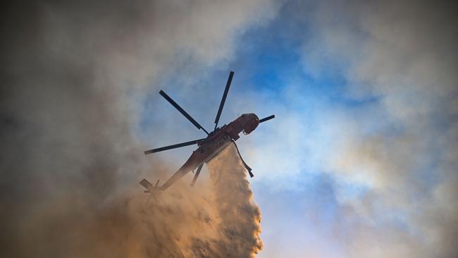 A Skycrane helicopter sprays water on the Greek Aegean island of Rhodes. Picture: AFP