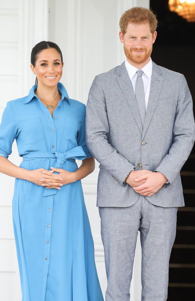 Meghan Markle and Prince Harry, who was again looking Suits-esque in Tonga yesterday. Picture: Getty Images