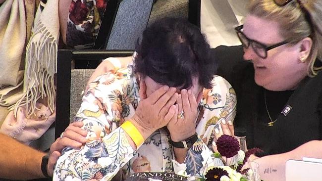 Debbie Kepitis reacting to winning the record-breaking auction.