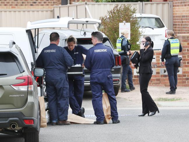 Forensic police on the scene of the stabbing. Picture: David Crosling