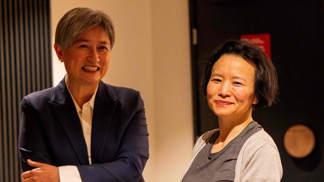 Foreign Minister Penny Wong, left, speaking with Lei upon her arrival at the airport in Melbourne. Picture: AFP