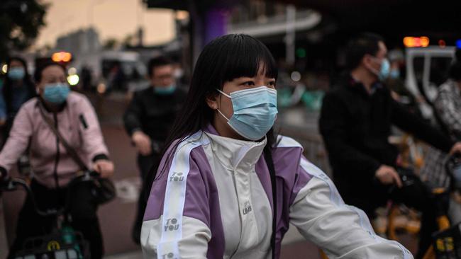 Commuters in Beijing. China has been a clear winner from the pandemic. Picture: AFP