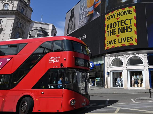 A government sign advising people to Stay Home, Protect the NHS, Save Lives in Piccadilly Circus. Picture: AFP