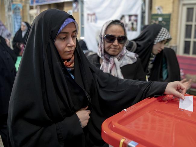 TEHRAN, IRAN - JULY 5: An Iranian woman casts her ballot at a polling station on July 5, 2024 in Tehran, Iran. The second round of Iran's presidential elections was held while no candidate won the majority of votes in the first round of elections last month. In the second round, Saeed Jalili, who is known as a radical candidate, faced Masoud Pezeshkian, a reformist candidate. (Photo by Majid Saeedi/Getty Images)