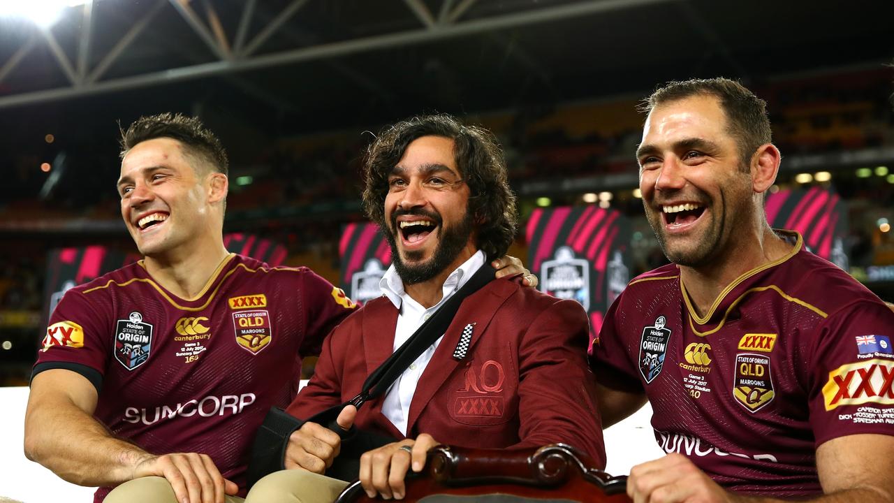 BRISBANE, AUSTRALIA - JULY 12: (L-R) Cooper Cronk, Johnathan Thurston and Cameron Smith of the Maroons pose with the State of Origin Trophy and celebrate winning the series game three of the State Of Origin series between the Queensland Maroons and the New South Wales Blues at Suncorp Stadium on July 12, 2017 in Brisbane, Australia. (Photo by Cameron Spencer/Getty Images)