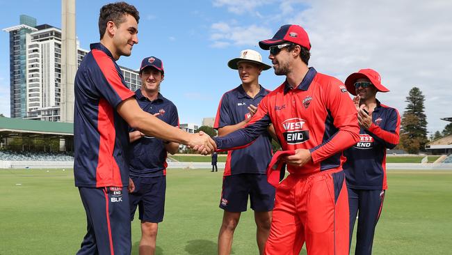 South Australia captain Travis Head (right) presents Peter Hatzoglou with his debut cap. Picture: Will Russell