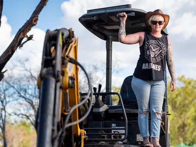 The community of Humpty Doo has seen a number of fires threaten lives and homes this fire season. Karlie Moyle had her home threatened by a fire and is in the process of cleaning up dead trees in her backyard.Picture: Che Chorley