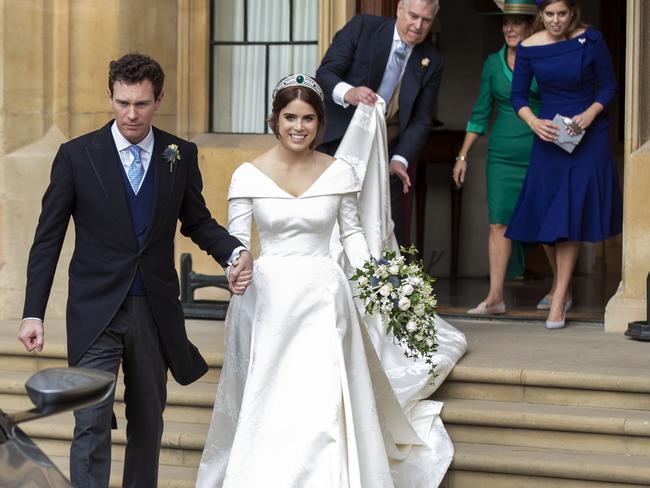 Princess Eugenie and Jack Brooksbank helped by Princess Beatrice and Prince Andrew, Duke of York leave Windsor Castle after their wedding. Picture: Getty