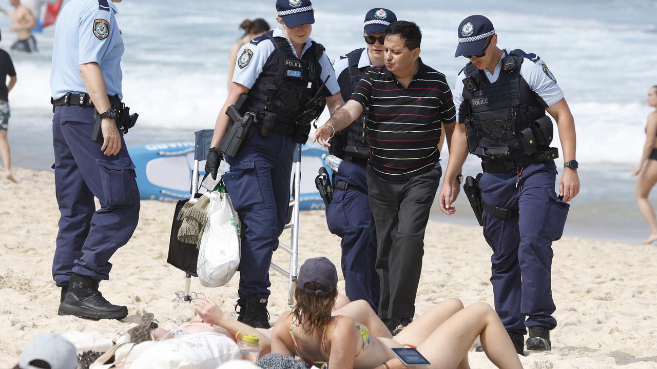 Lewd-photo accused banned from beaches