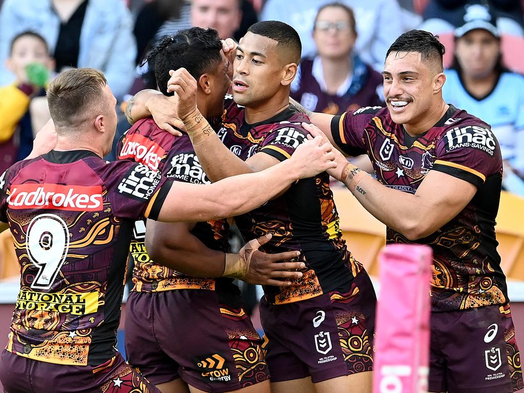 The return of Kotoni Staggs (R) inspired Brisbane to victory. (Photo by Bradley Kanaris/Getty Images)