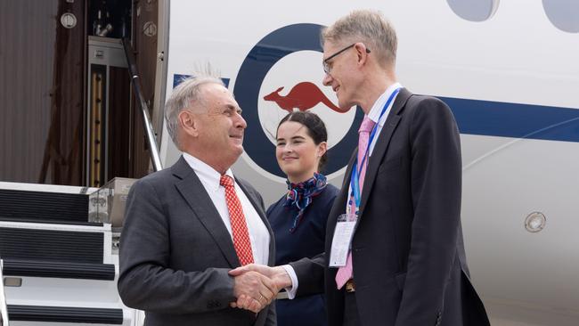 Trade Minister Don Farrell is greeted on his arrival in Beijing by the Australian ambassador to China, Graham Fletcher.