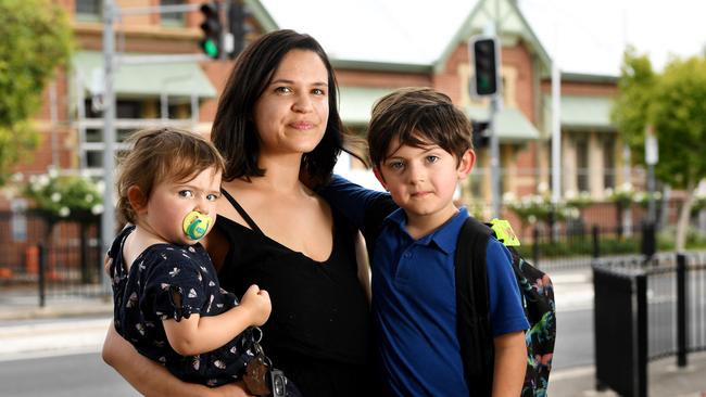 Adelaide mum Pauline Adolle with children June, 22 months, months and Kyle 5. Last month, Ms Adolle took her children out of school as a precaution amid the pandemic. Picture: Tricia Watkinson