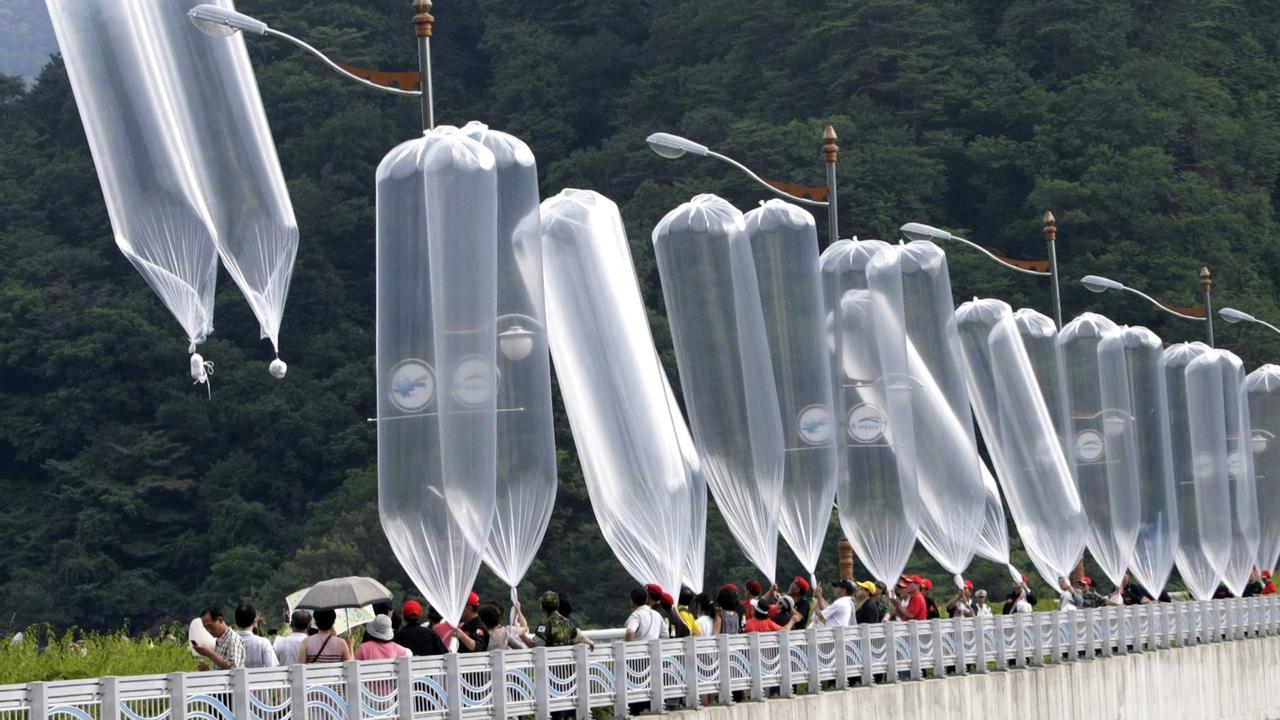 South Korean conservative activists launch balloons carrying leaflets denouncing the North Korean leader. Picture: Ahn Young-joon/AP, File