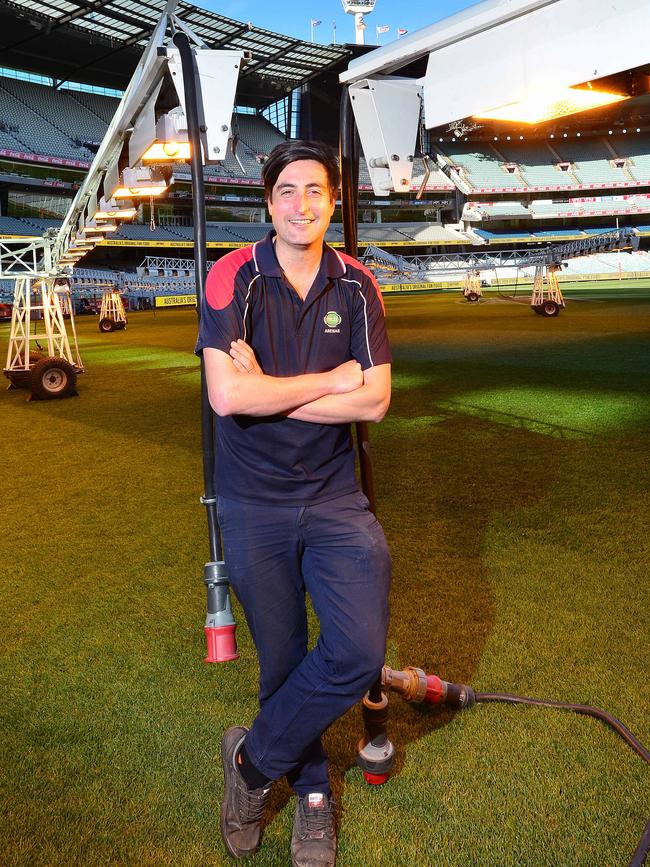 By the time the grand final starts, Michael Salvatore and his team will have mowed the MGC lawn four times. Picture: Nicki Connolly