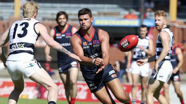 Norwood’s Mitch Grigg gets his handpass away against the Panthers.