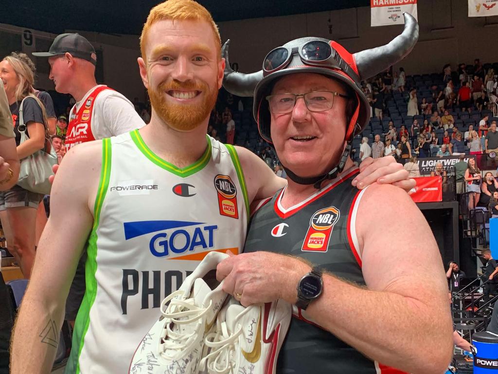 South East Melbourne guard Angus Glover gifted Hawks superfan Graham Lancaster a pair of his sneakers, signed by every Hawk and every Phoenix player. Picture: Supplied