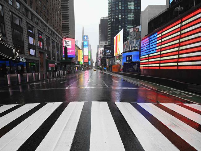 New York’s Times Square resembled a ghost town as the city entered its first full day of lockdown. Picture: AFP