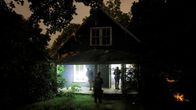 Secret Service and Homeland Security agents check a former home associated with the suspect. Picture: Reuters