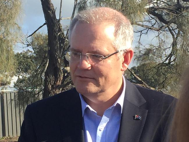 Treasurer Scott Morrison talks to first home buyers in Craigieburn, Melbourne, Saturday, May 13, 2017. (AAP Image/Jacqueline Le) NO ARCHIVING