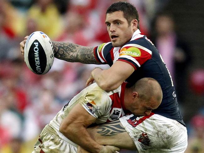 Daniel Conn being tackled by Dragon Matt Cooper during the 2010 NRL Grand Final.