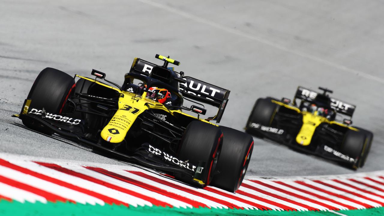 Daniel Ricciardo trailing teammate Esteban Ocon early in the race. (Photo by Mark Thompson/Getty Images)