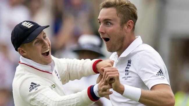 England's Stuart Broad, right, celebrates with teammate Joe Root.