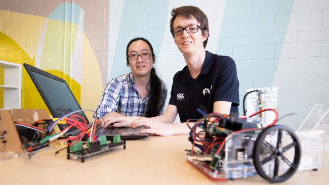 Ryoma Ohira and Tim Braithwaite are ready to take on Japan with their sumo robots. Picture: Luke Marsden.