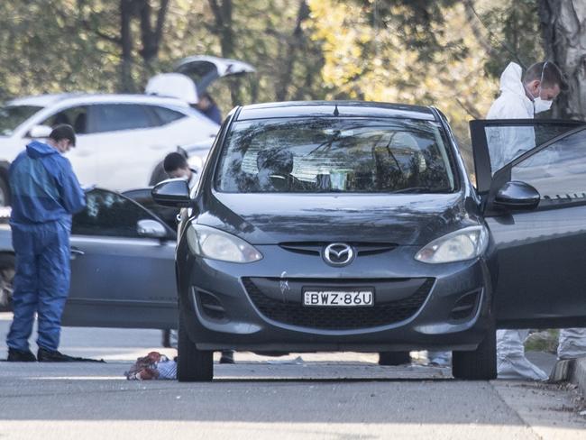 Police combing over Mr Al-Azzam’s car at the scene in Greenacre last year. Picture: NCA NewsWIRE