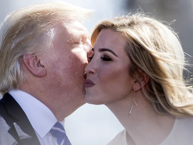 US President Donald Trump (L) kisses his daughter Ivanka Trump.  Picture:  AFP