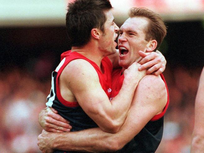 Andrew Leoncelli and David Neitz embrace in the 2000 qualifying final.