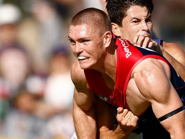 ALICE SPRINGS, AUSTRALIA - JUNE 02: Adam Tomlinson of the Demons is tackled by Bailey Banfield of the Dockers during the 2024 AFL Round 12 match between the Melbourne Demons and the Fremantle Dockers at TIO Traeger Park on June 02, 2024 in Alice Springs, Australia. (Photo by Michael Willson/AFL Photos via Getty Images)