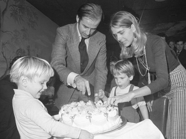 Joseph Biden and his first wife Nelia cut his 30th birthday cake at a party in Wilmington, with son, Hunter, waiting for the first piece.