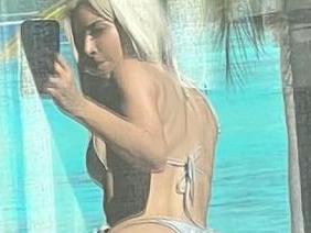 Kim K posts cheeky window selfie