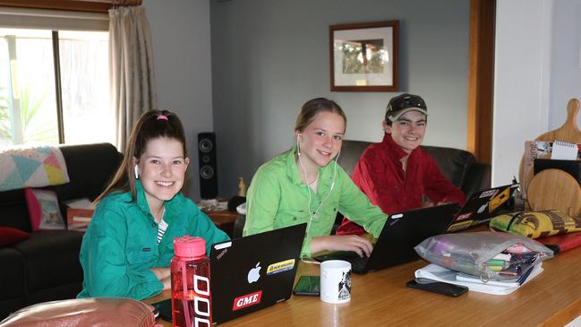 Home front: Ballarat Grammar students Larah Butler, Sky Fitzgerald and Liam Butler study online together in Balranald NSW. Picture: Claire Butler