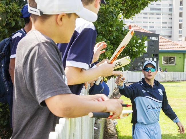 Steve Smith signs autographs for kids during the game at Manly. Picture: Jenny Evans