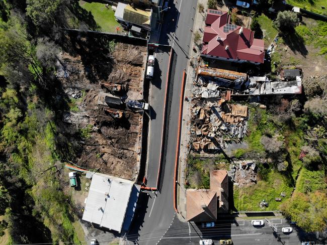 Clearing of the shops burned down in the main street of Cobargo last year. Picture: Toby Zerna