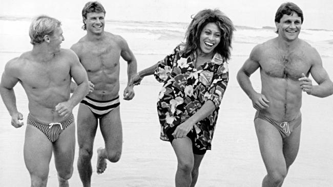 Tina Turner with Allan Langer, Andrew Ettinghausen and Wayne Pearce all the way back in 1990. Photo: Peter Muhlbock.